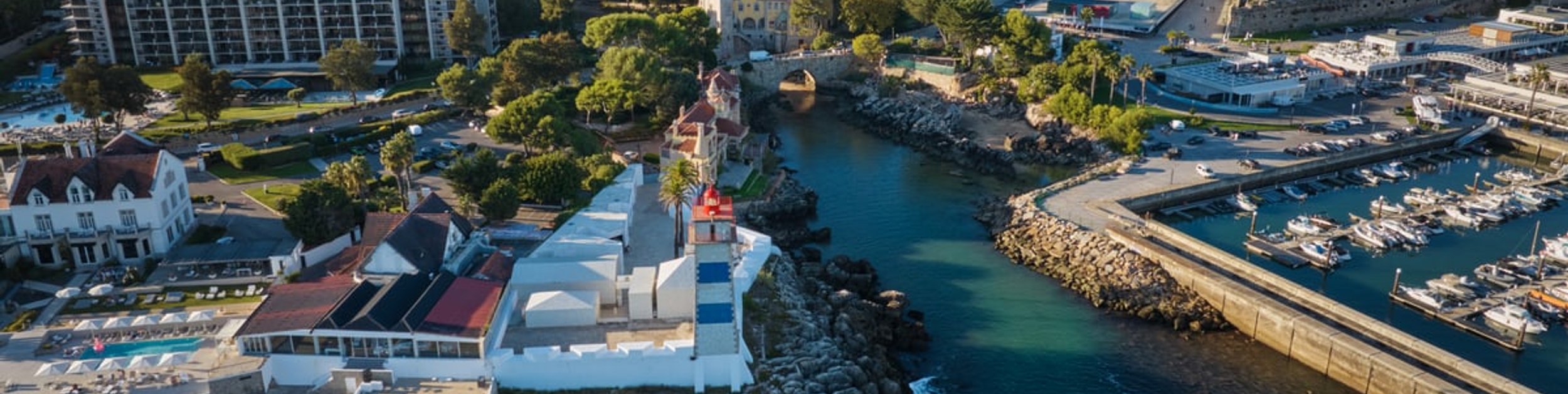 The marina, lighthouse and headland at Cascais from the air