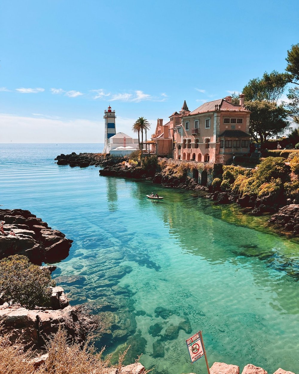 Clear water in the cove below the Santa Marta lighthouse, Cascais
