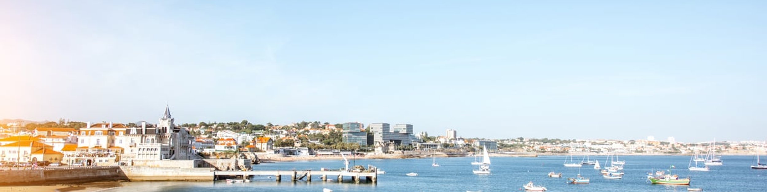 Fishing boats moored in the calm bay at Cascais